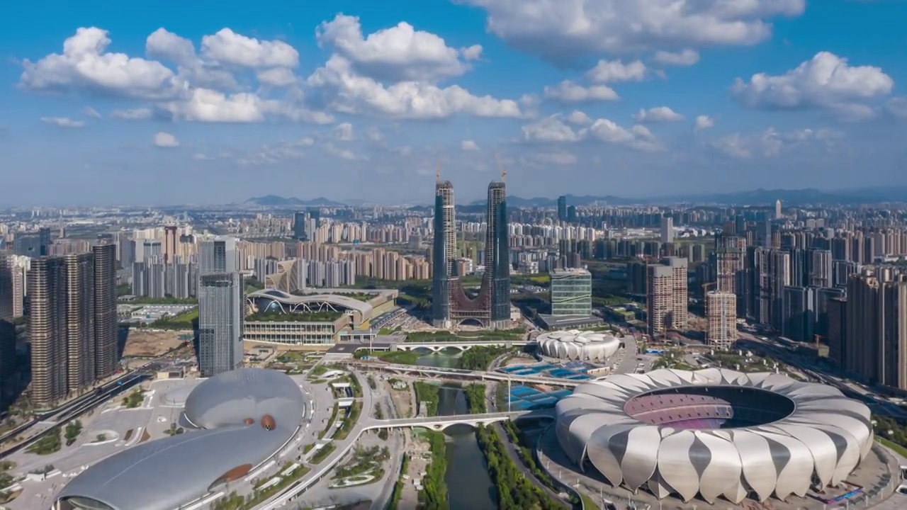 杭州奥体博览城和杭州之门白昼航拍延时视频素材