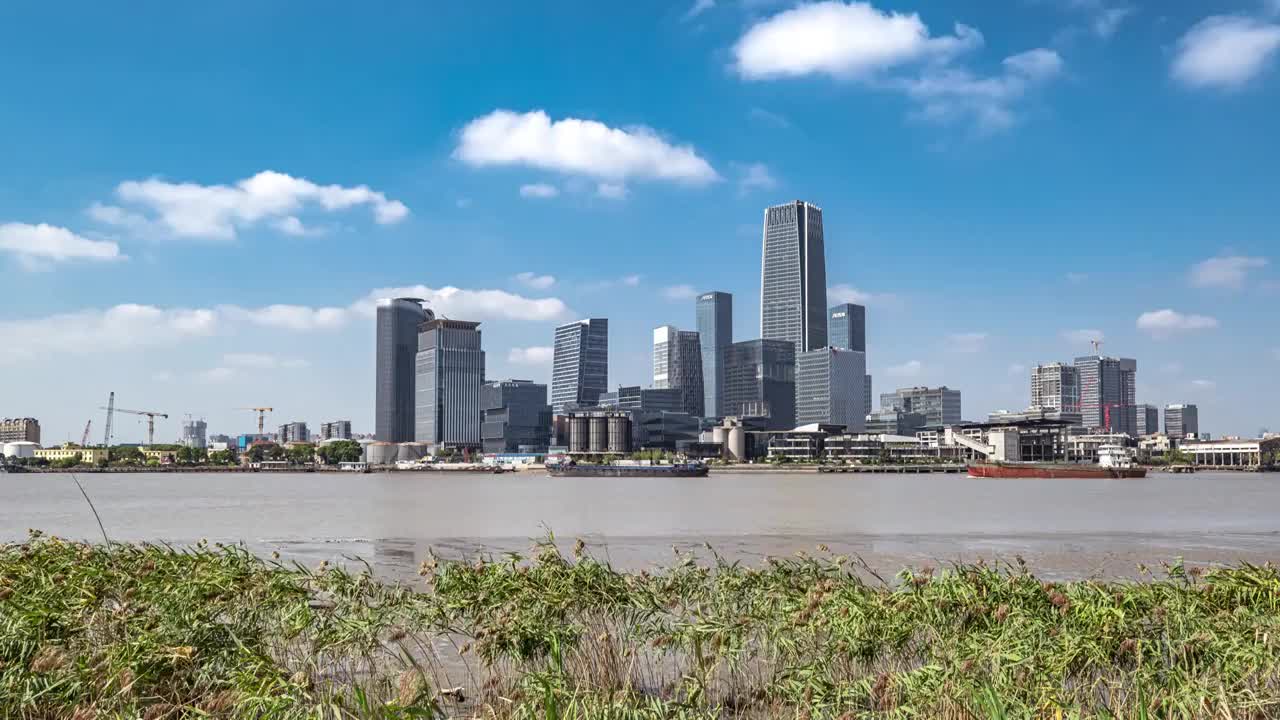 蓝天白云下上海徐汇滨西岸城市CBD建筑群延时视频素材
