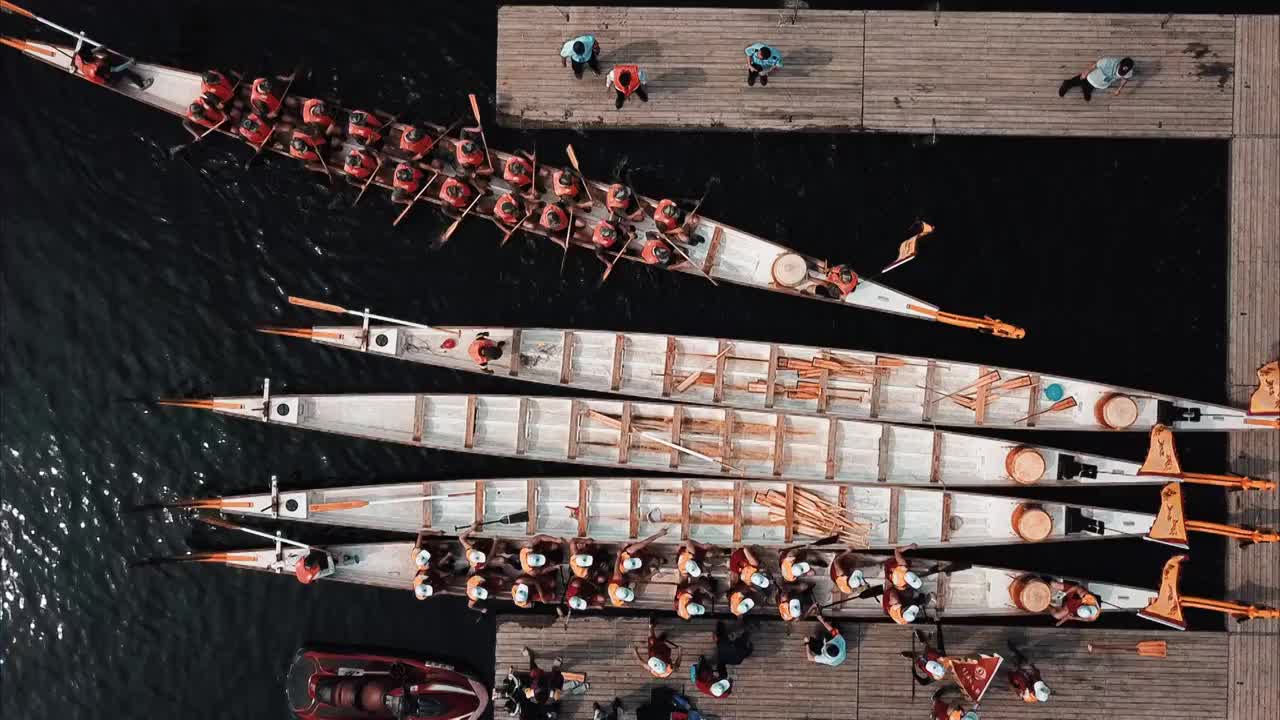 【原创】4K航拍端午节龙舟划出码头视频素材
