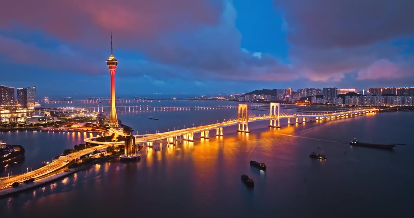 航拍澳门城市建筑和桥梁风光在夜晚视频素材