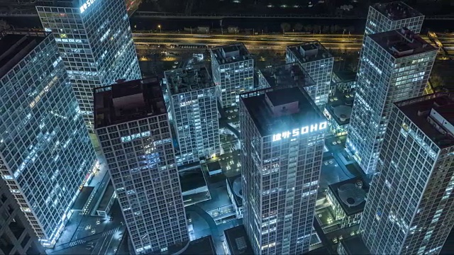 T/L HA PAN鸟瞰图照明摩天大楼在晚上/北京，中国视频素材