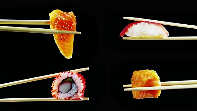寿司质量高，打开黑色背景，显示其所有的好，饮食和健康的食物，美味的味道，寿司很好与鲑鱼或金枪鱼，是一个典型的日本食物视频购买