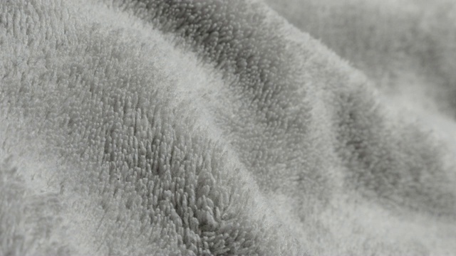 羊毛或极地羊毛聚酯纹理缓慢倾斜4K 3840X2160超高清视频-聚对苯二甲酸乙二醇酯织物又名织锦羊毛特写纤维和表面4K 2160p 30fps超高清视频视频下载