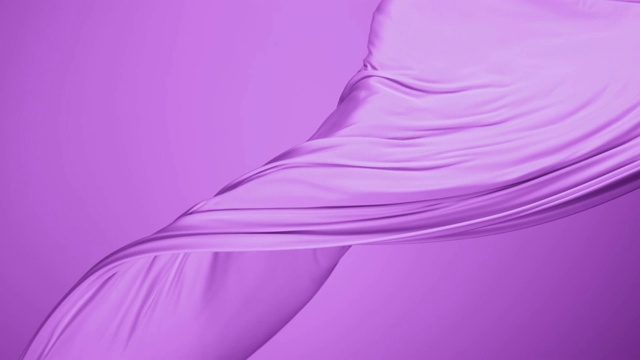 紫色的丝质织物在紫色的背景下随风飘动，慢镜头视频素材