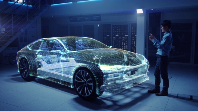 电动汽车底盘平台的汽车工程师，使用平板电脑和增强现实3D软件。创新设施:带轮子的车架成为实体虚拟模型。视频购买
