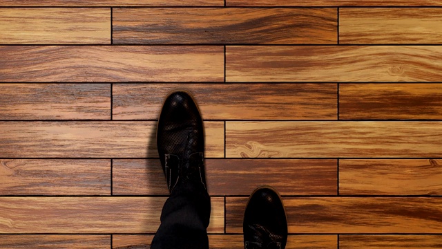 商人脚踩在拼木地板上，使脚步前移，工作机会视频下载