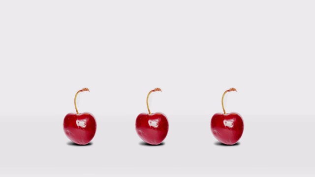 3个快乐跳跃的樱桃在一排动画视频购买
