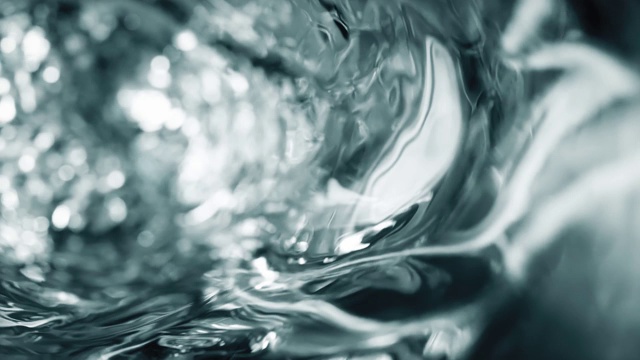 杯子里的水是慢動作的。摘要水背景。無縫循環3d渲染視頻素材