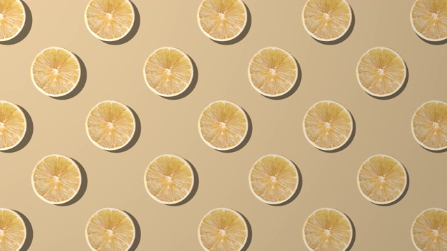 黄色背景上的柠檬片纺纱图案视频素材