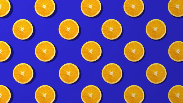 橙色切片纺纱图案，蓝色背景视频素材