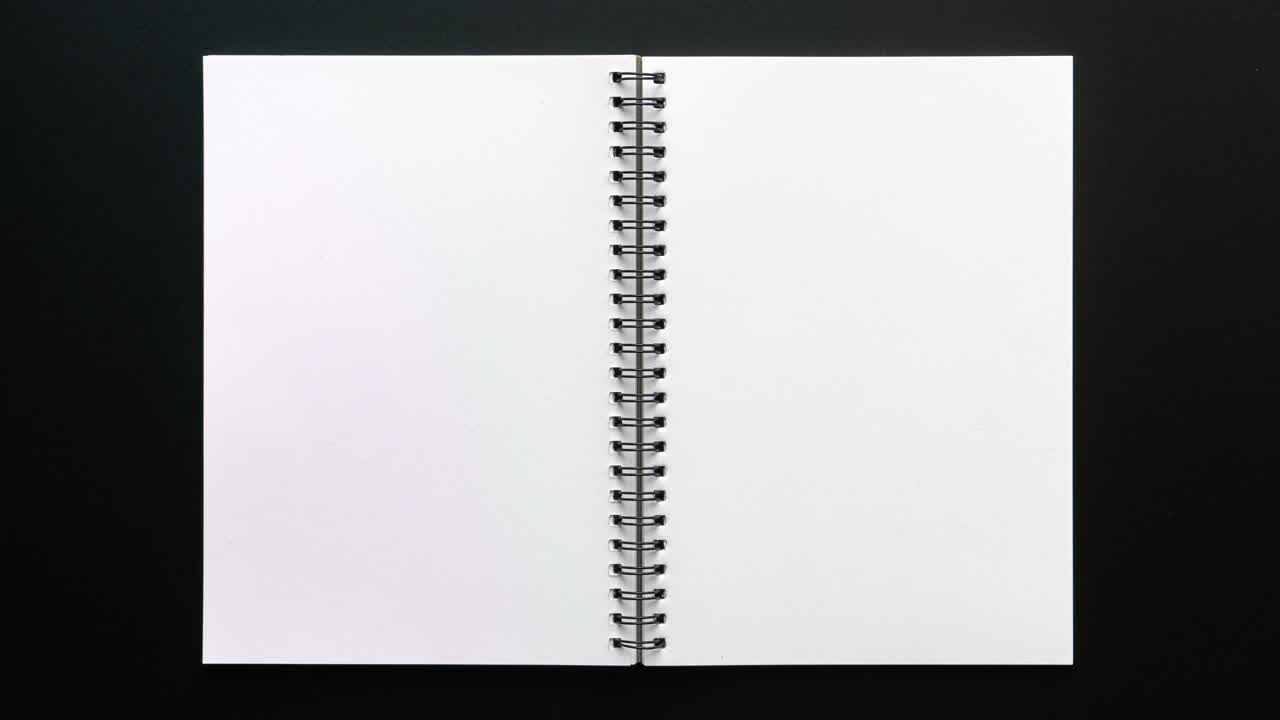 4k停止运动的笔记本打开空白页在黑色背景视频下载