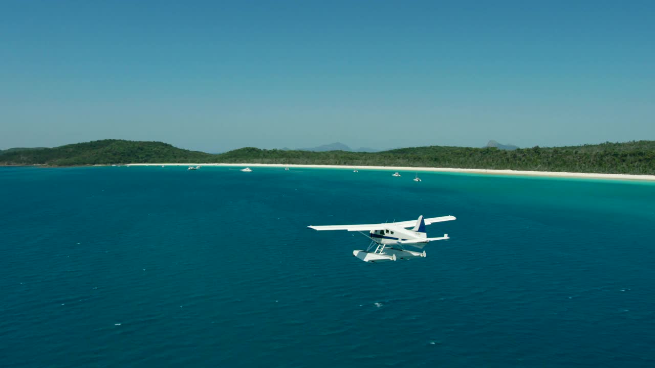 日出空中水上飞机降落怀特黑文海滩堡礁视频素材