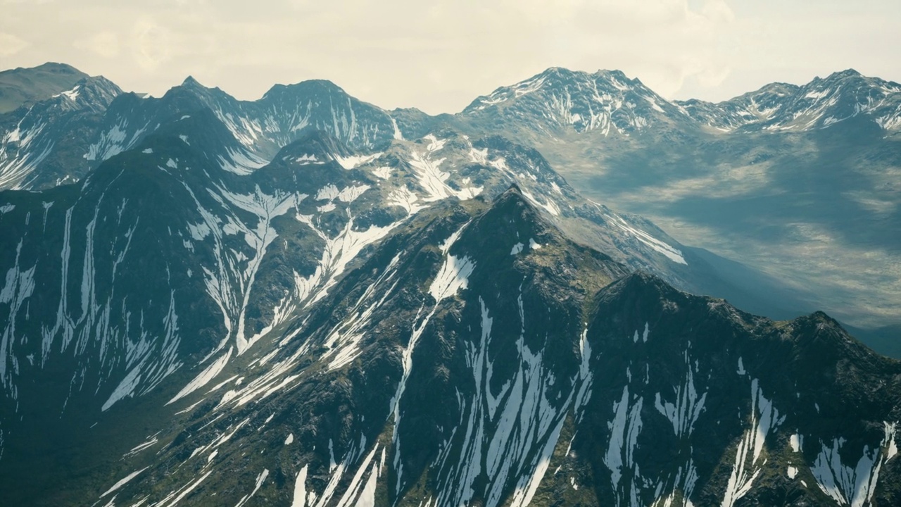 空中俯瞰山谷，远处是雪山视频下载