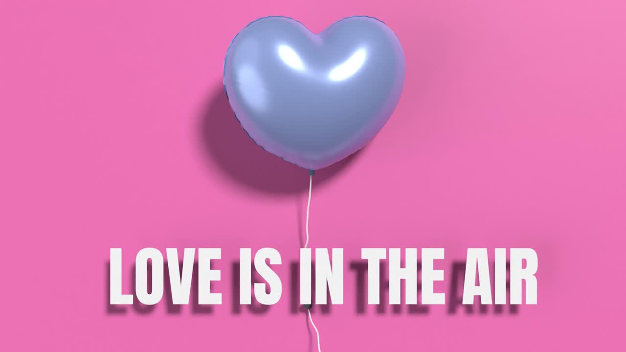 爱在空气中，写在一个蓝色的氦气球心形在粉红色的墙壁上，4K分辨率视频下载