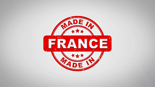 法国制造签名盖章文字木制邮票动画。红色墨水在干净的白纸表面背景与绿色哑光背景包括在内。视频素材
