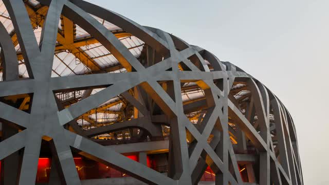 日转夜 北京奥林匹克公园鸟巢特写延时摄影视频素材