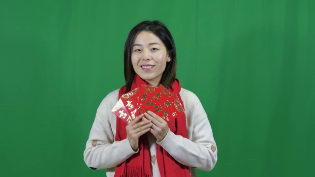 4k高清视频亚洲女士恭贺新年拜年绿幕可抠图视频素材