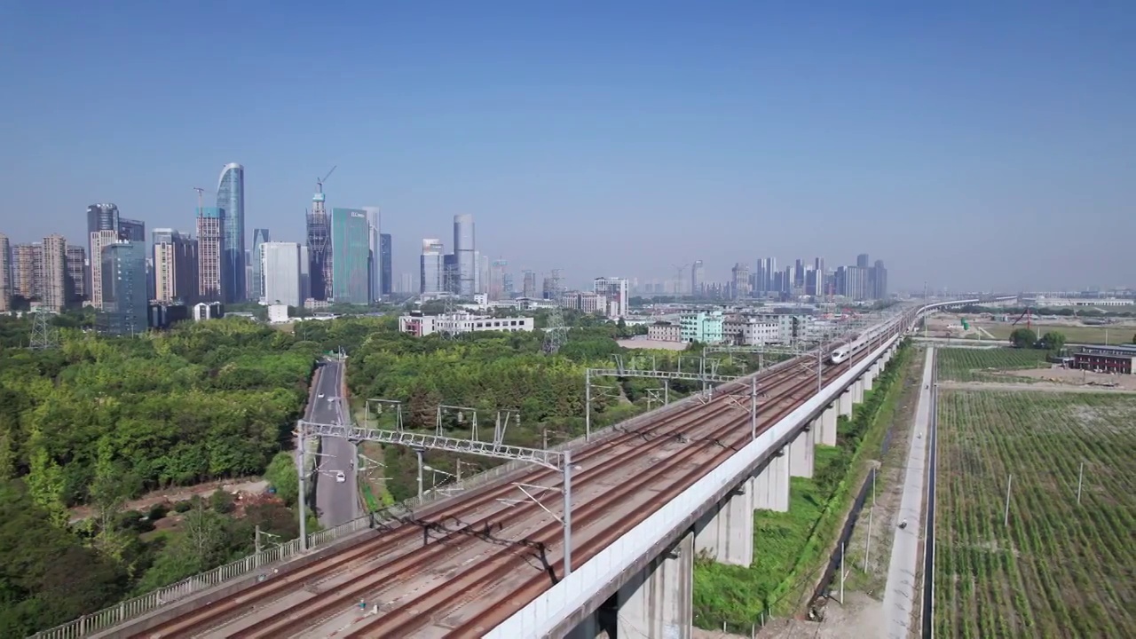 航拍高铁穿过现代城市杭州萧山视频素材