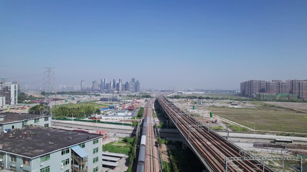航拍高铁穿过现代城市杭州萧山视频素材