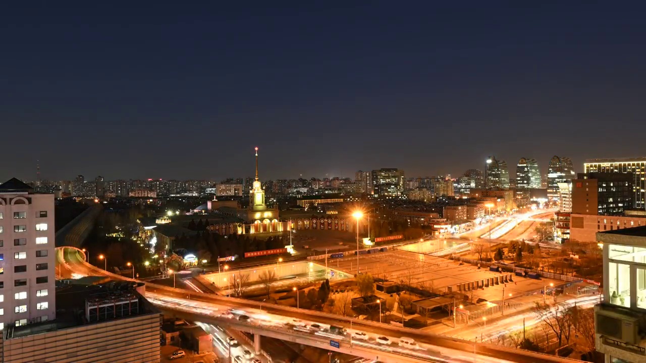 北京展览馆和交通车流日转夜城市风光视频素材