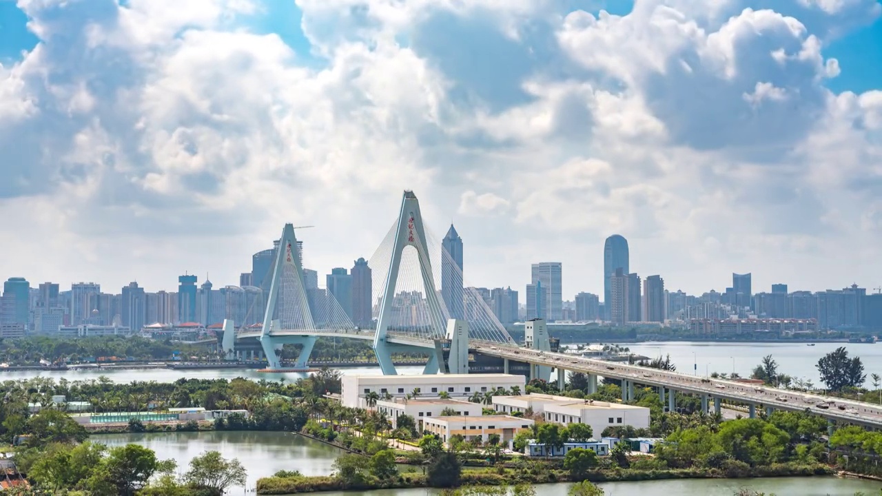 中国海南省海口市世纪大桥和城市天际线白天延时摄影视频下载