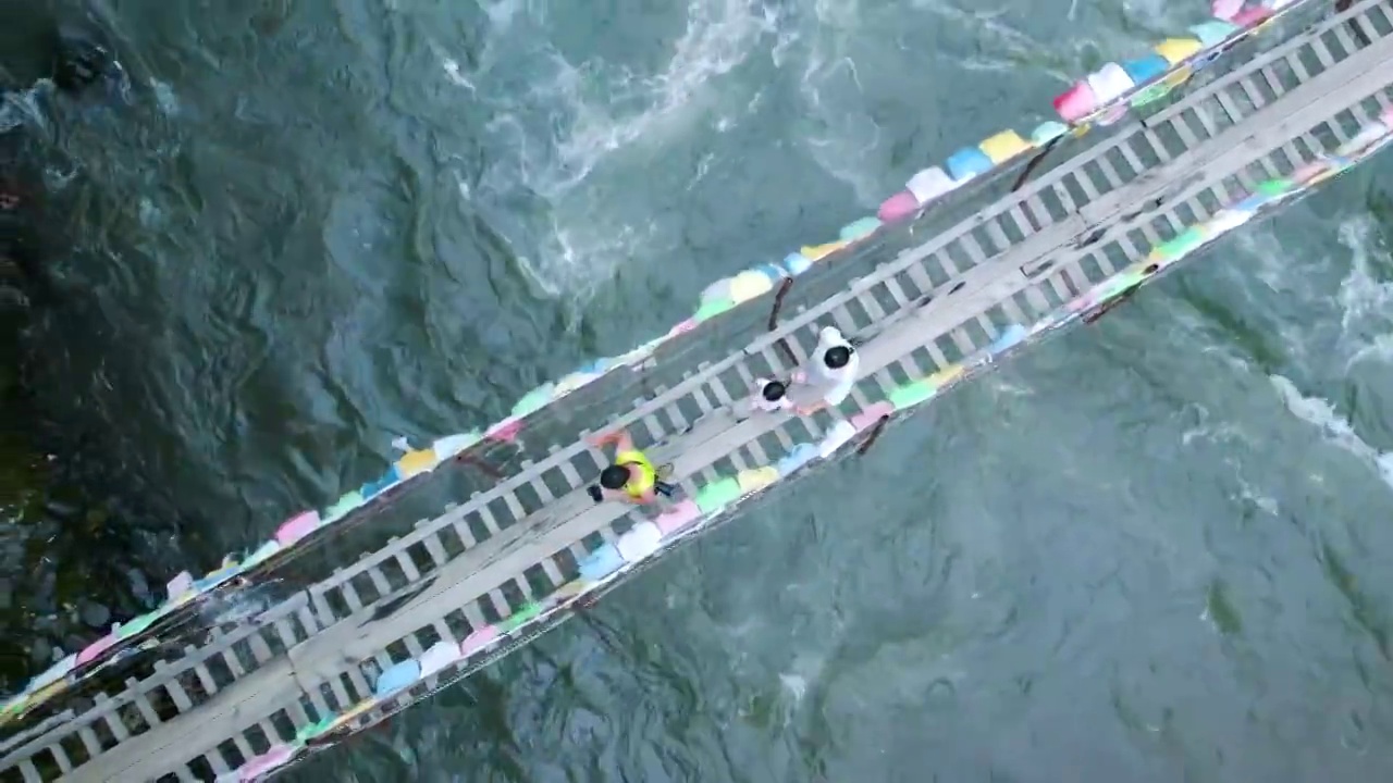 航拍藏族河流铁锁木桥航拍视频素材