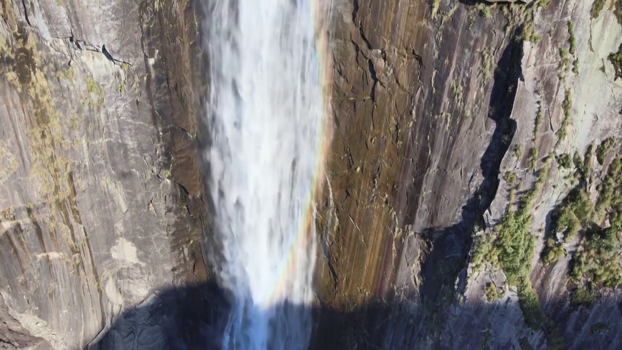 高空瀑布飞流直下磅礴大气森林彩虹高山航拍视频素材
