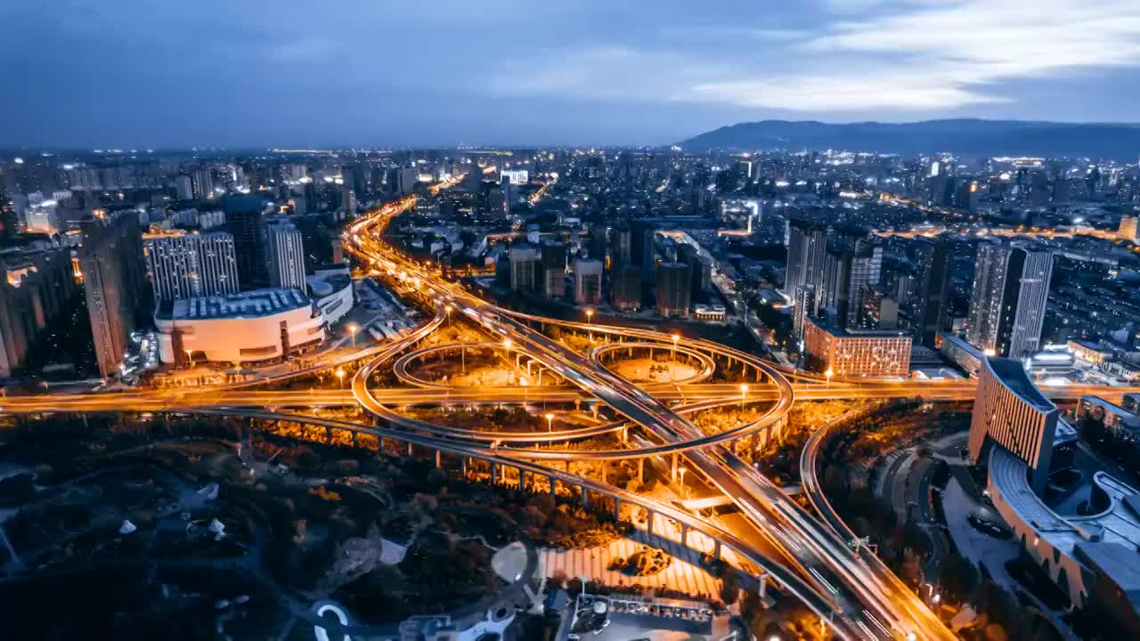 中国内蒙古呼和浩特兴安南路立交桥夜景环绕延时航拍视频素材