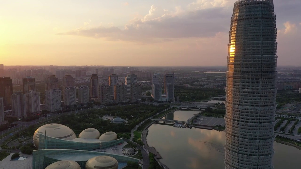 河南郑州CBD城市风光与都市天际线夏季日落时分户外航拍视频素材