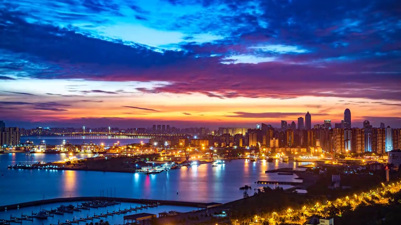 中国海南省海口市港口码头城市天际线日出延时摄影视频素材
