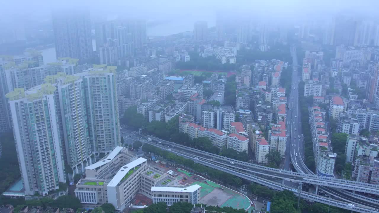 广州城市建筑群与天空雨雾天气航拍风光视频素材