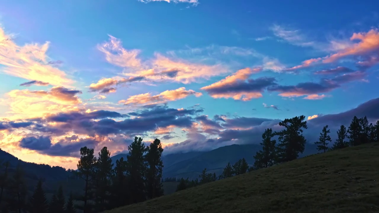 航拍中国新疆日出时山脉草原自然风光视频素材
