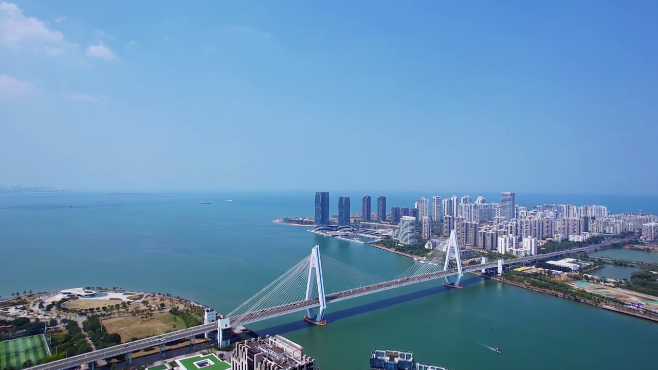 中国海南海口海甸河世纪大桥晴天风光俯瞰航拍视频素材