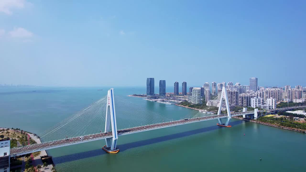 中国海南海口海甸河世纪大桥晴天风光俯瞰航拍视频素材