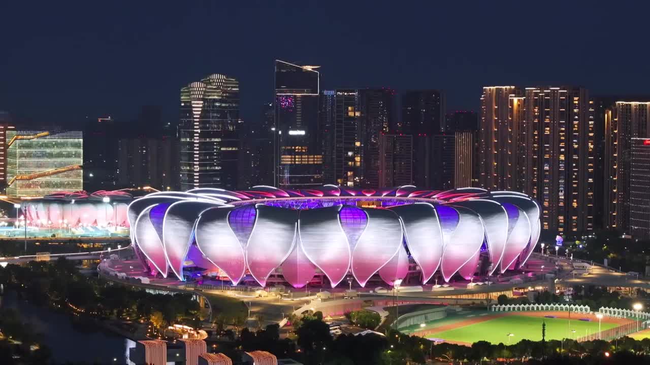 中国浙江杭州亚运会奥体中心夜晚灯光秀航拍视频购买