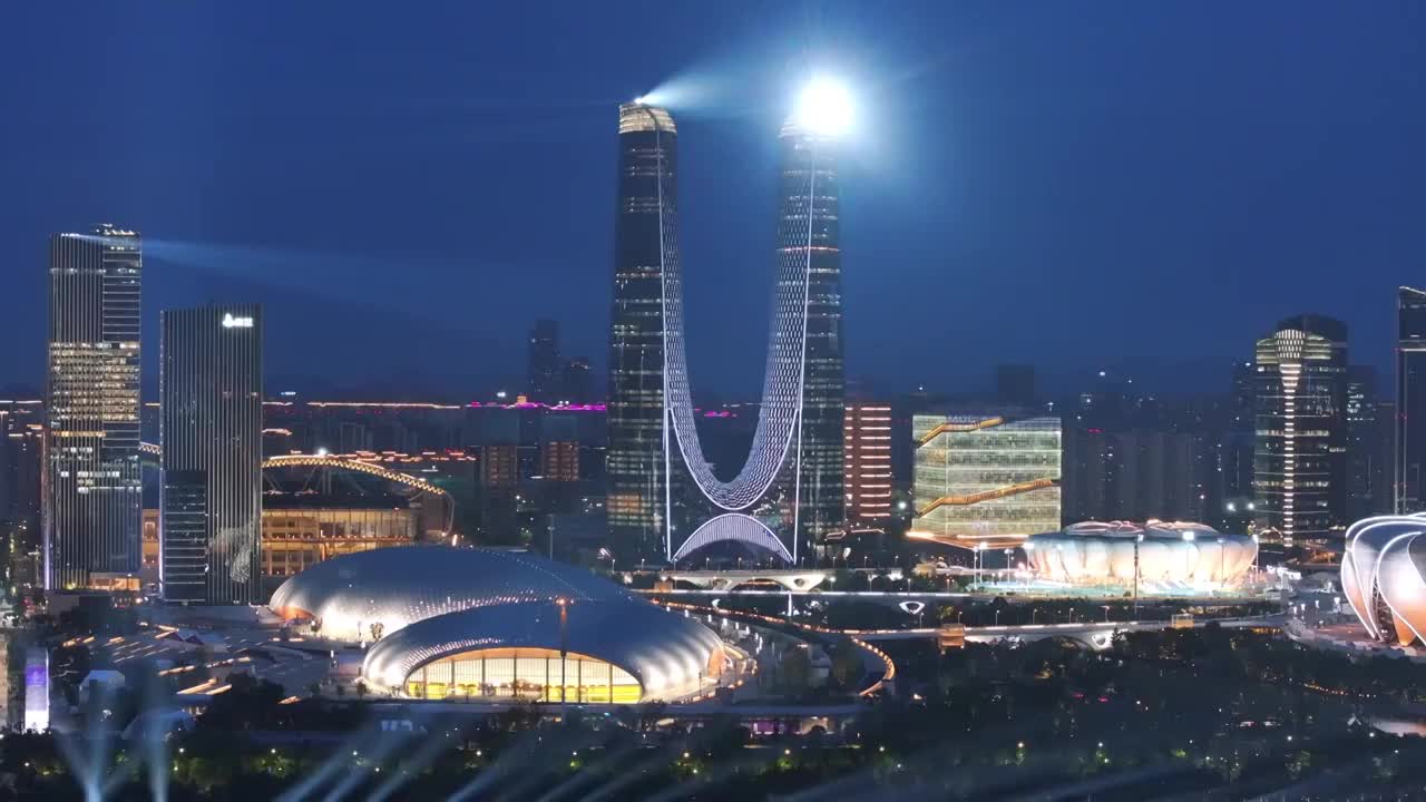 中国浙江杭州亚运会奥体中心夜晚灯光秀航拍视频购买