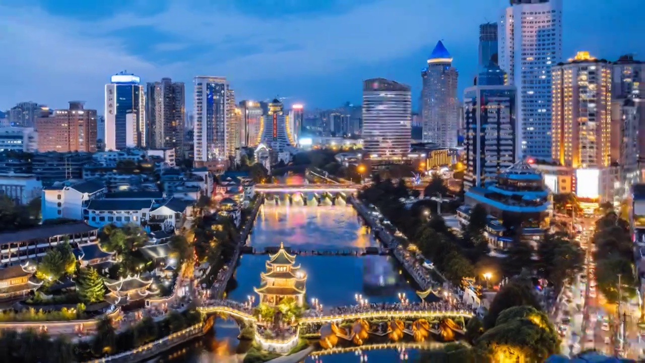中国贵州贵阳甲秀楼和城市天际线夜景航拍环绕延时摄影视频下载