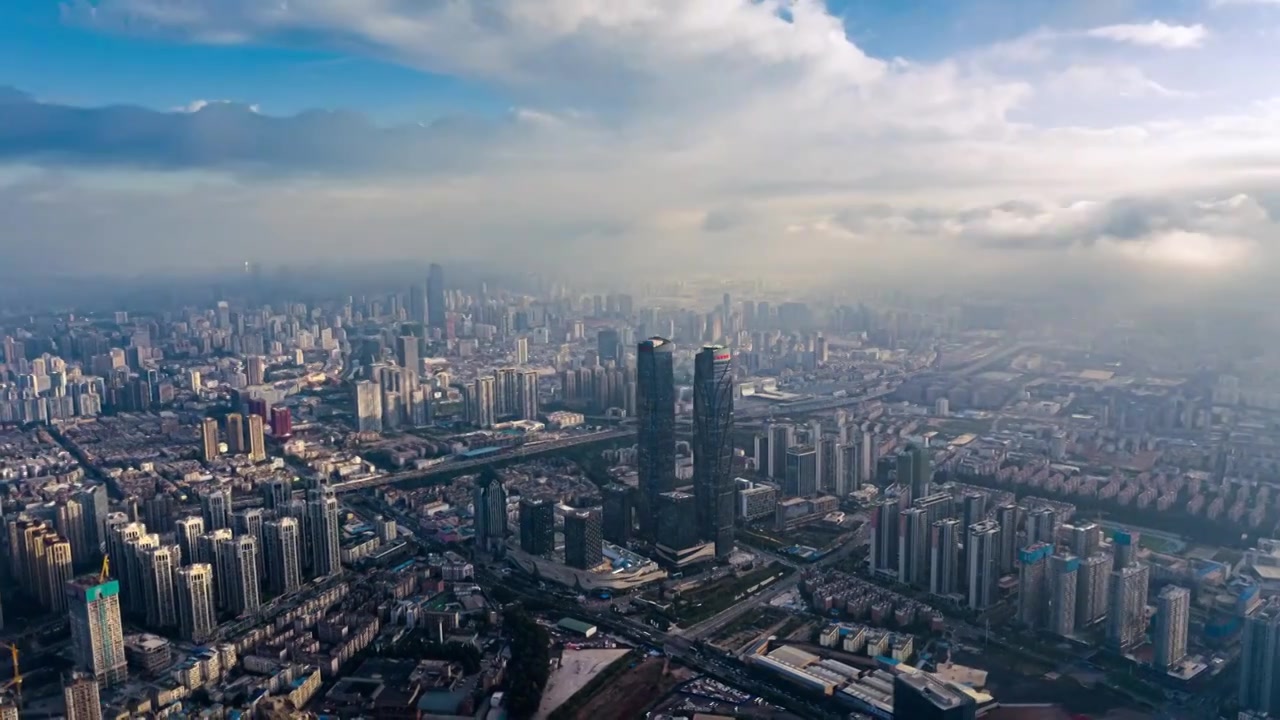 云南昆明双子塔城市航拍蓝天白云视频素材