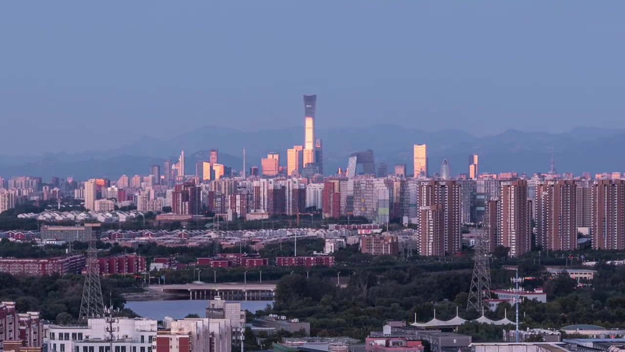国贸温榆河同框远眺京城北京日出金光延时4k视频素材