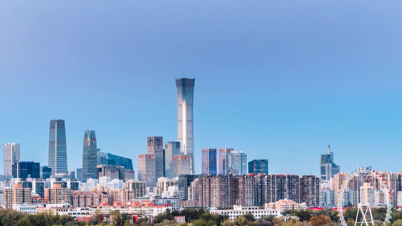 中国北京CBD建筑群天际线和摩天轮高视角日转夜延时摄影视频下载