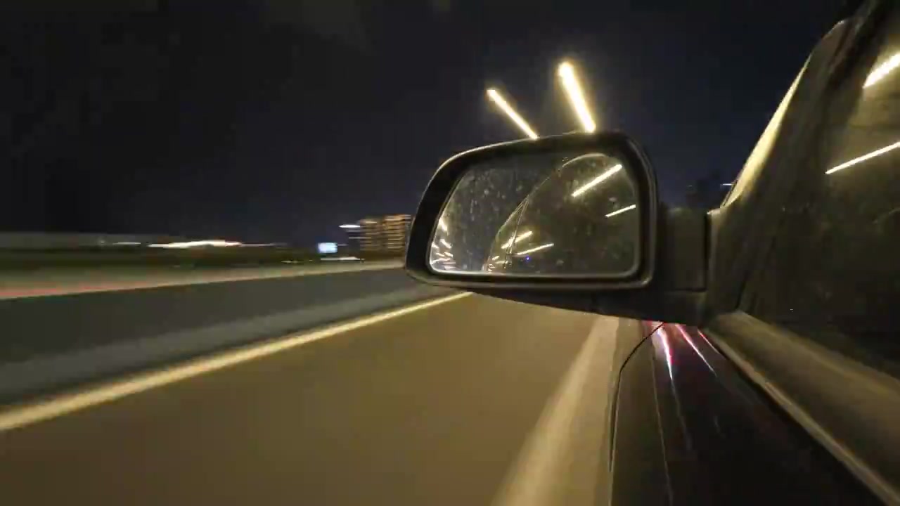 驾车行驶在夜晚城市高架桥下道路隧道视频素材