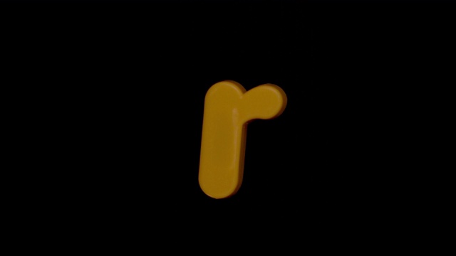 字母r在黑色背景中用慢动作聚焦视频素材