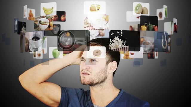 褐发男子在食物的慢动作视频之间犹豫的动画视频素材