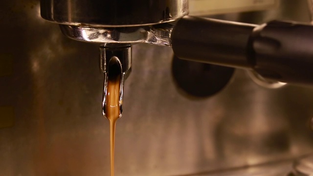 Coffee Streaming Down from the Spout of Coffee Machine视频素材