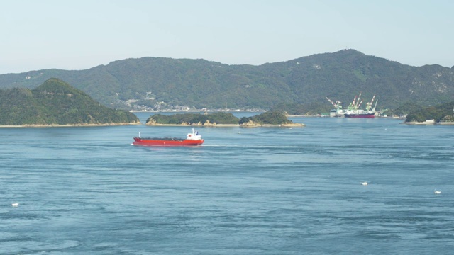 Cargo ship moving on Seto Inland Sea视频素材
