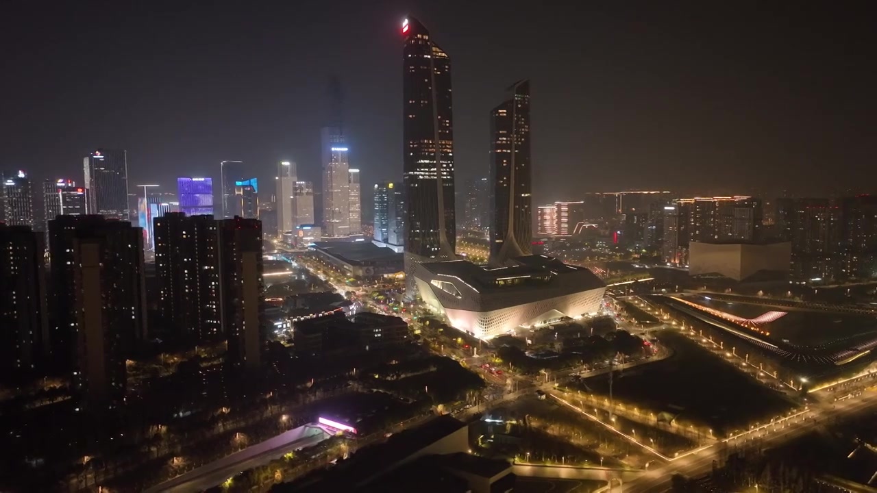 中国江苏南京保利大剧院、南京青奥中心双塔楼夜景航拍视频素材