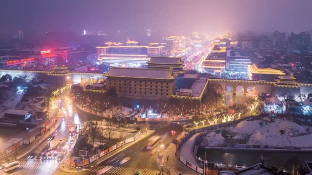 西安城墙西门冬季雪景夜景延时视频素材
