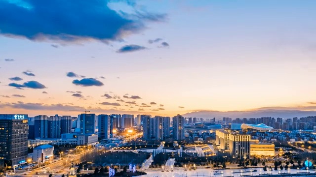 中国内蒙古呼和浩特新华大街城市日落日转夜延时摄影视频素材