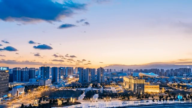 中国内蒙古呼和浩特新华大街城市日落日转夜延时摄影视频素材