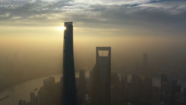 雨过天晴霞光映照下的上海陆家嘴金融区摩天大楼城市建筑景观视频下载